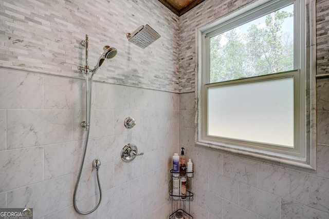 full bath featuring tiled shower