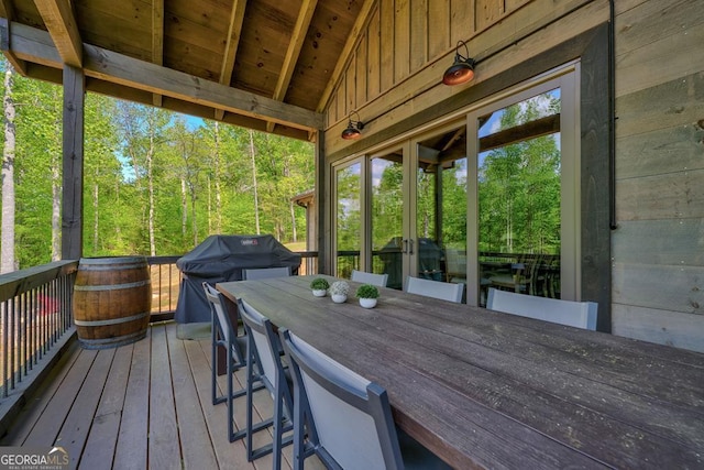 wooden terrace featuring area for grilling
