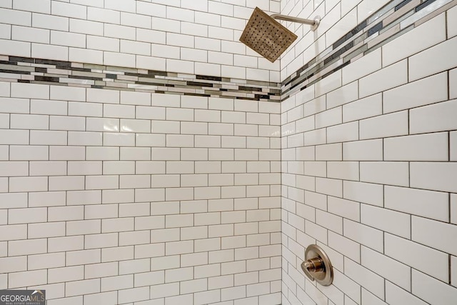 full bath with a tile shower