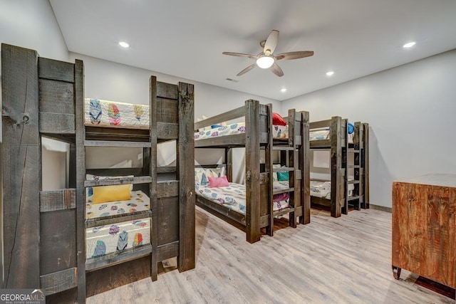 bedroom with a ceiling fan, recessed lighting, and wood finished floors