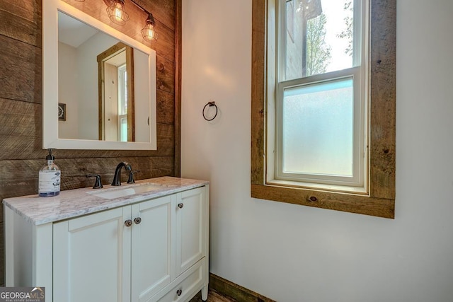 bathroom with vanity and decorative backsplash