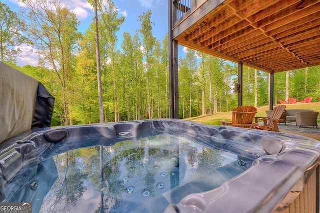 view of pool featuring a hot tub