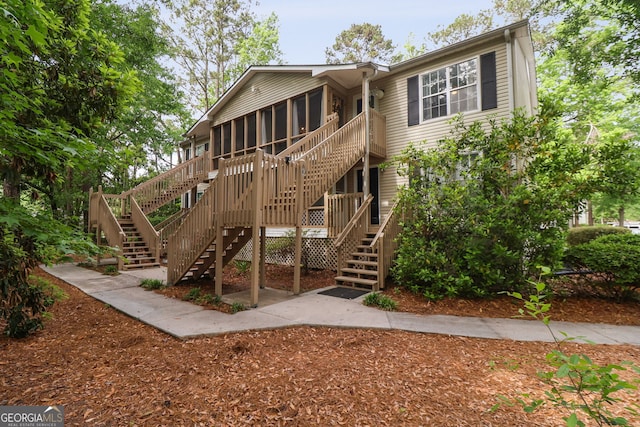 401 N Cromwell Rd Unit 6K, Savannah, GA 31410 - exterior space featuring a sunroom and stairs