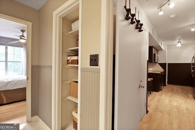 401 N Cromwell Rd Unit 6K, Savannah, GA 31410 - corridor with light wood finished floors and a wainscoted wall