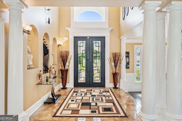 3364 Kylee Dawn Cir, Lawrenceville, GA 30045 - foyer entrance featuring plenty of natural light, a decorative wall, a high ceiling, marble tiled floors, and a wainscoted wall