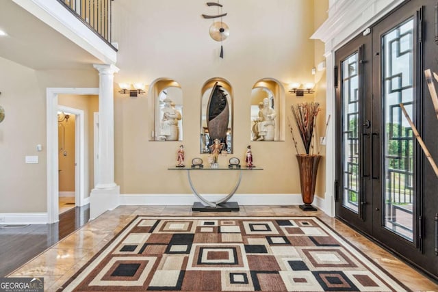 3364 Kylee Dawn Cir, Lawrenceville, GA 30045 - foyer entrance featuring decorative columns, french doors, plenty of natural light, and a towering ceiling