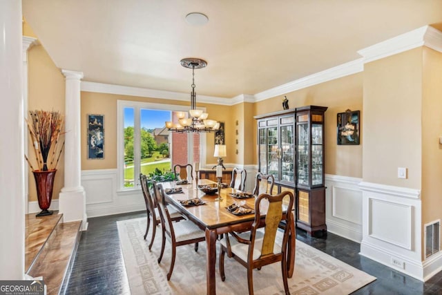 3364 Kylee Dawn Cir, Lawrenceville, GA 30045 - dining area with a wainscoted wall, ornate columns, a chandelier, a decorative wall, and ornamental molding