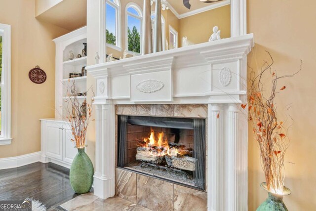 3364 Kylee Dawn Cir, Lawrenceville, GA 30045 - room details featuring crown molding, a fireplace, and baseboards