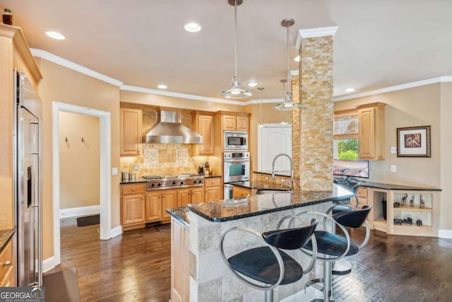 3364 Kylee Dawn Cir, Lawrenceville, GA 30045 - kitchen with wall chimney exhaust hood, built in appliances, a kitchen breakfast bar, ornamental molding, and dark wood-type flooring