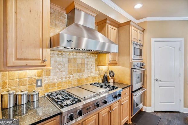 3364 Kylee Dawn Cir, Lawrenceville, GA 30045 - kitchen featuring wall chimney exhaust hood, stainless steel appliances, crown molding, dark wood-style floors, and dark stone counters