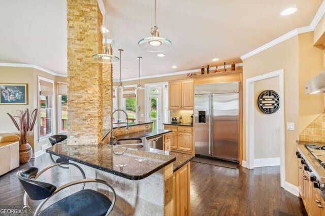 3364 Kylee Dawn Cir, Lawrenceville, GA 30045 - kitchen featuring a sink, stainless steel appliances, decorative backsplash, light brown cabinets, and baseboards