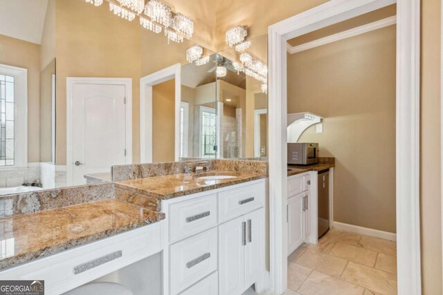 3364 Kylee Dawn Cir, Lawrenceville, GA 30045 - full bathroom with vanity and a chandelier