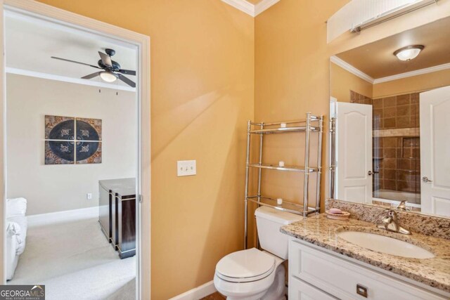 3364 Kylee Dawn Cir, Lawrenceville, GA 30045 - bathroom with baseboards, toilet, crown molding, and a ceiling fan