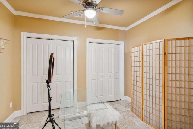 3364 Kylee Dawn Cir, Lawrenceville, GA 30045 - unfurnished bedroom featuring ornamental molding, multiple closets, tile patterned floors, ceiling fan, and baseboards