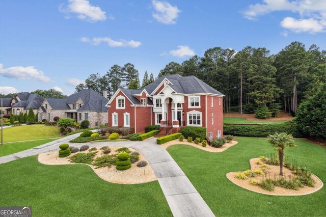 3364 Kylee Dawn Cir, Lawrenceville, GA 30045 - view of front of property featuring curved driveway and a front yard