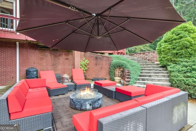 3364 Kylee Dawn Cir, Lawrenceville, GA 30045 - view of patio featuring stairway and an outdoor living space with a fire pit