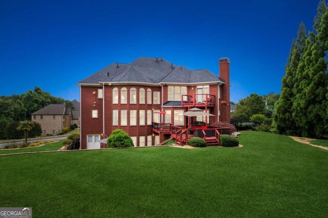 3364 Kylee Dawn Cir, Lawrenceville, GA 30045 - rear view of property with a chimney, a lawn, a balcony, and a wooden deck