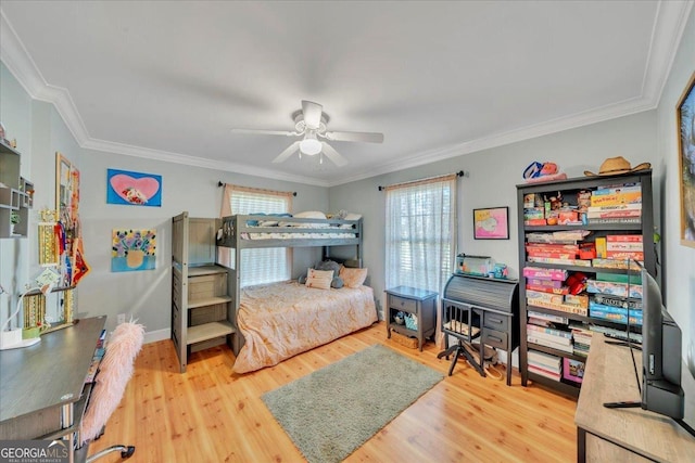 bedroom featuring wood finished floors, a ceiling fan, and ornamental molding