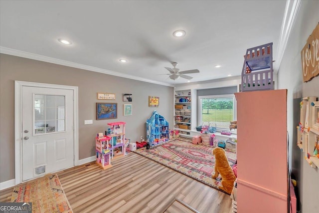 playroom featuring crown molding, wood finished floors, ceiling fan, and recessed lighting
