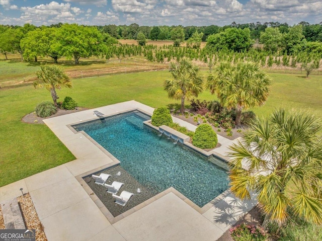 outdoor pool with a yard