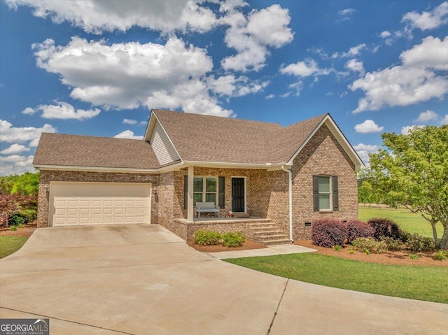 single story home featuring covered porch, an attached garage, concrete driveway, a front lawn, and brick siding