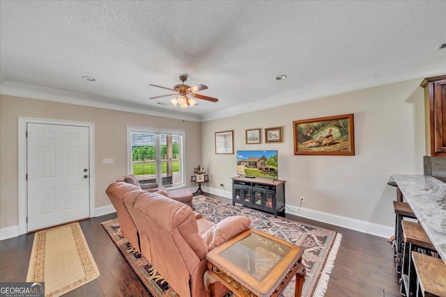 living area featuring ornamental molding, a textured ceiling, and a ceiling fan