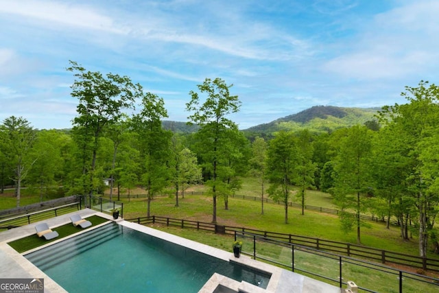 51 Birdseye Vw, Blue Ridge, GA 30513 - view of swimming pool featuring fence, a mountain view, a rural view, a fenced in pool, and a lawn
