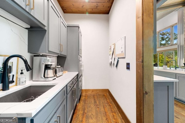 51 Birdseye Vw, Blue Ridge, GA 30513 - kitchen with wooden ceiling, light stone counters, stainless steel oven, a sink, and gray cabinets