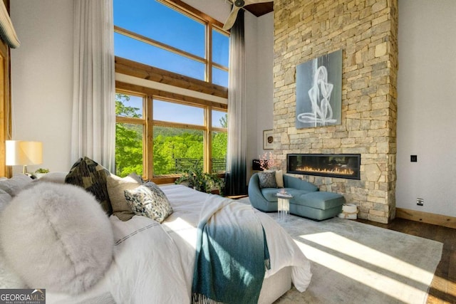 51 Birdseye Vw, Blue Ridge, GA 30513 - bedroom featuring baseboards, a stone fireplace, and a high ceiling
