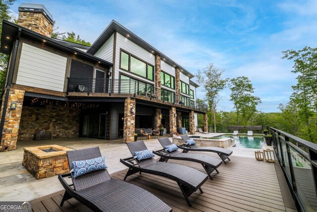 51 Birdseye Vw, Blue Ridge, GA 30513 - wooden deck with a hot tub, an outdoor fire pit, a patio area, and an outdoor pool