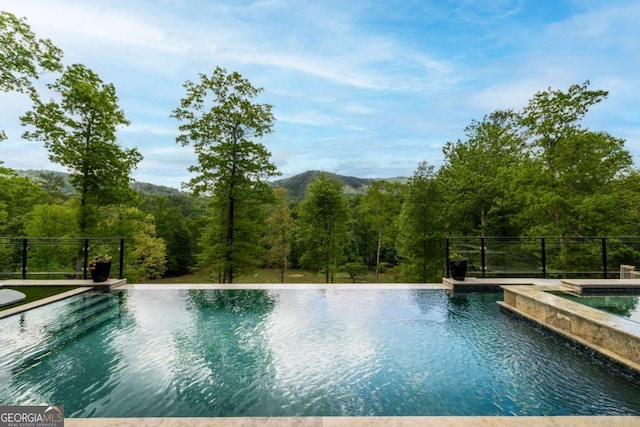 51 Birdseye Vw, Blue Ridge, GA 30513 - view of swimming pool featuring fence, a view of trees, and a fenced in pool