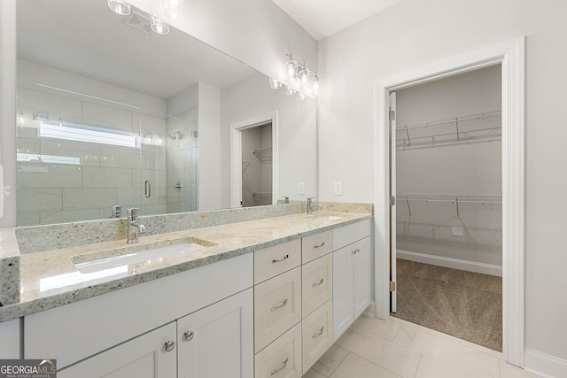 bathroom featuring a stall shower, marble finish floor, visible vents, and a sink