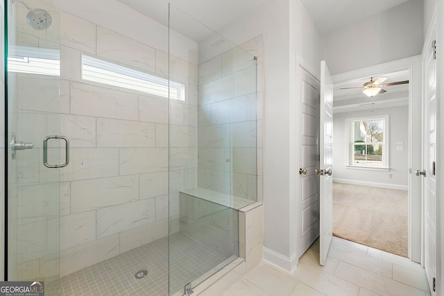 bathroom with a stall shower, baseboards, a ceiling fan, and marble finish floor