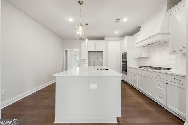 kitchen with a sink, stainless steel appliances, tasteful backsplash, and visible vents