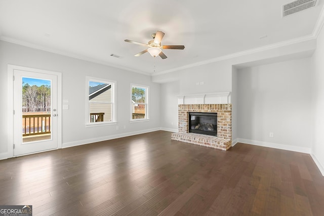 unfurnished living room featuring a wealth of natural light, visible vents, and a ceiling fan