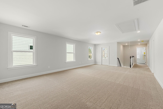 unfurnished room with baseboards, recessed lighting, visible vents, and attic access