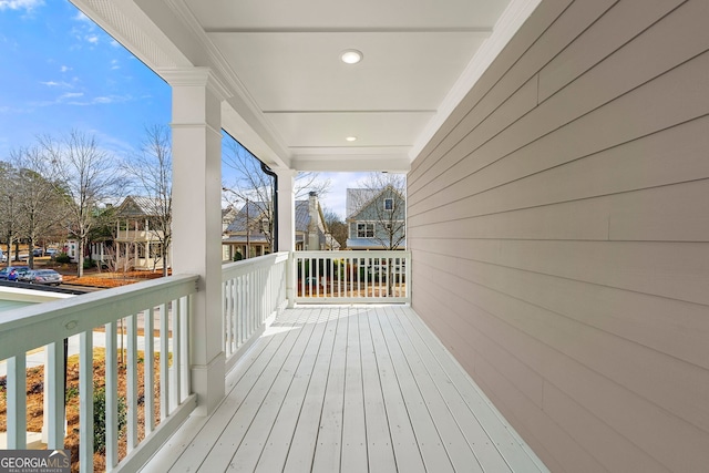 wooden deck with a residential view