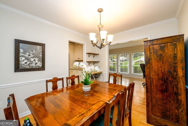 2804 Dunnington Cir, Chamblee, GA 30341 - dining room featuring a chandelier, ornamental molding, and light wood-type flooring