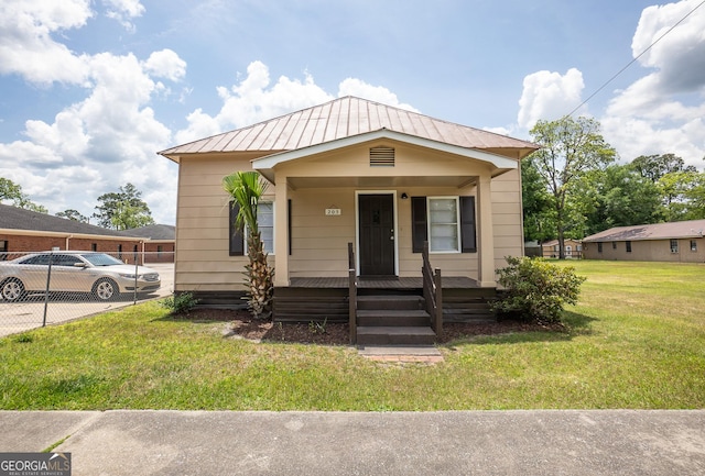 205 Butler St, Waycross, GA 31501 - bungalow with covered porch, metal roof, and a front lawn