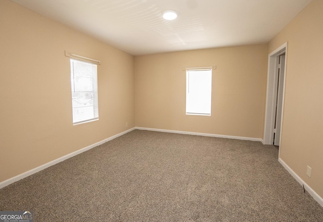 205 Butler St, Waycross, GA 31501 - spare room featuring carpet floors and baseboards