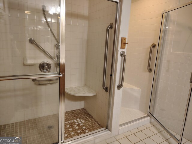 bathroom featuring a shower stall and tile patterned floors