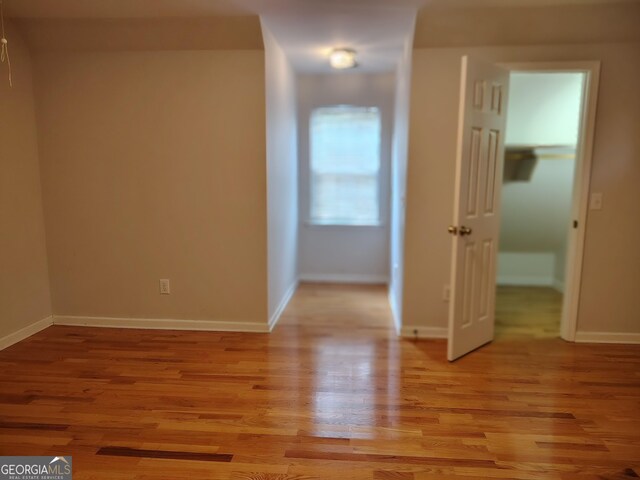 interior space with light wood finished floors and baseboards