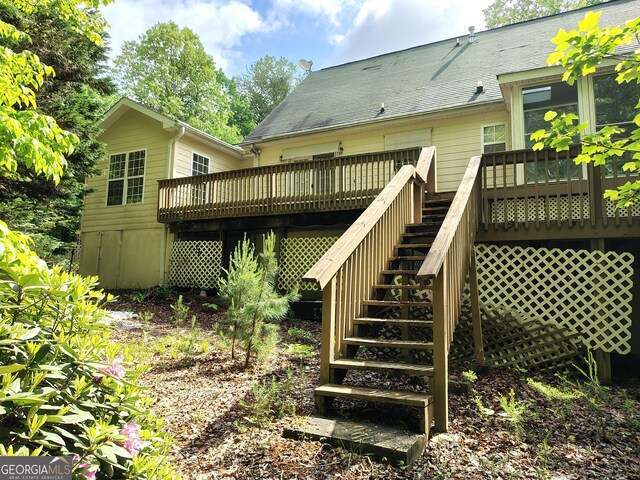 wooden deck featuring stairway