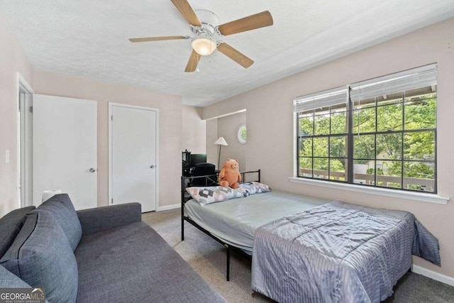 4971 Sharp Way, Duluth, GA 30096 - carpeted bedroom with baseboards, a ceiling fan, and a textured ceiling