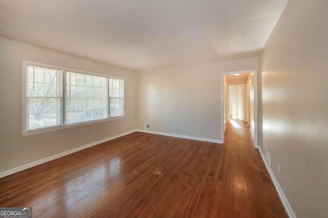 6575 Wendell Cir, Morrow, GA 30260 - spare room featuring baseboards and dark wood finished floors
