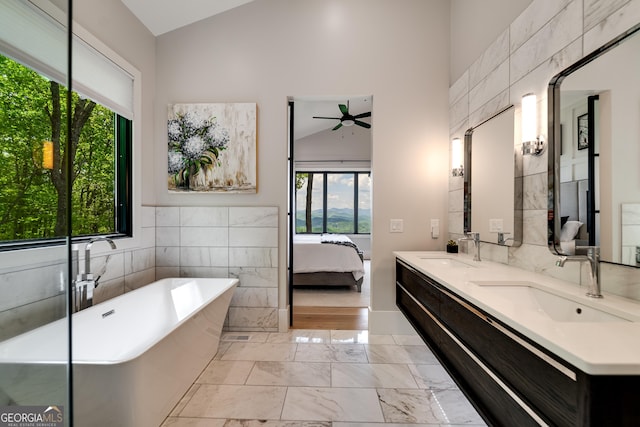 377 Charmont Dr, Tiger, GA 30576 - ensuite bathroom with a sink, ceiling fan, tile walls, and a soaking tub
