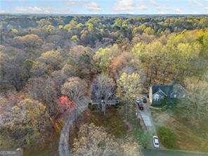 aerial view featuring a forest view
