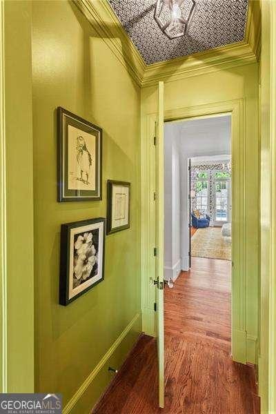 13922 Tree Loft Rd, Milton, GA 30004 - hallway featuring an ornate ceiling, dark wood finished floors, and ornamental molding