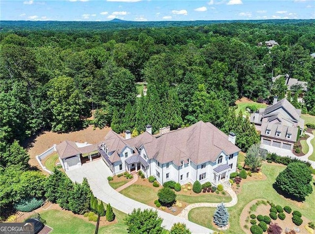 13922 Tree Loft Rd, Milton, GA 30004 - aerial view featuring a wooded view