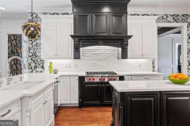 13922 Tree Loft Rd, Milton, GA 30004 - kitchen with a sink, stainless steel appliances, light countertops, white cabinets, and dark cabinetry